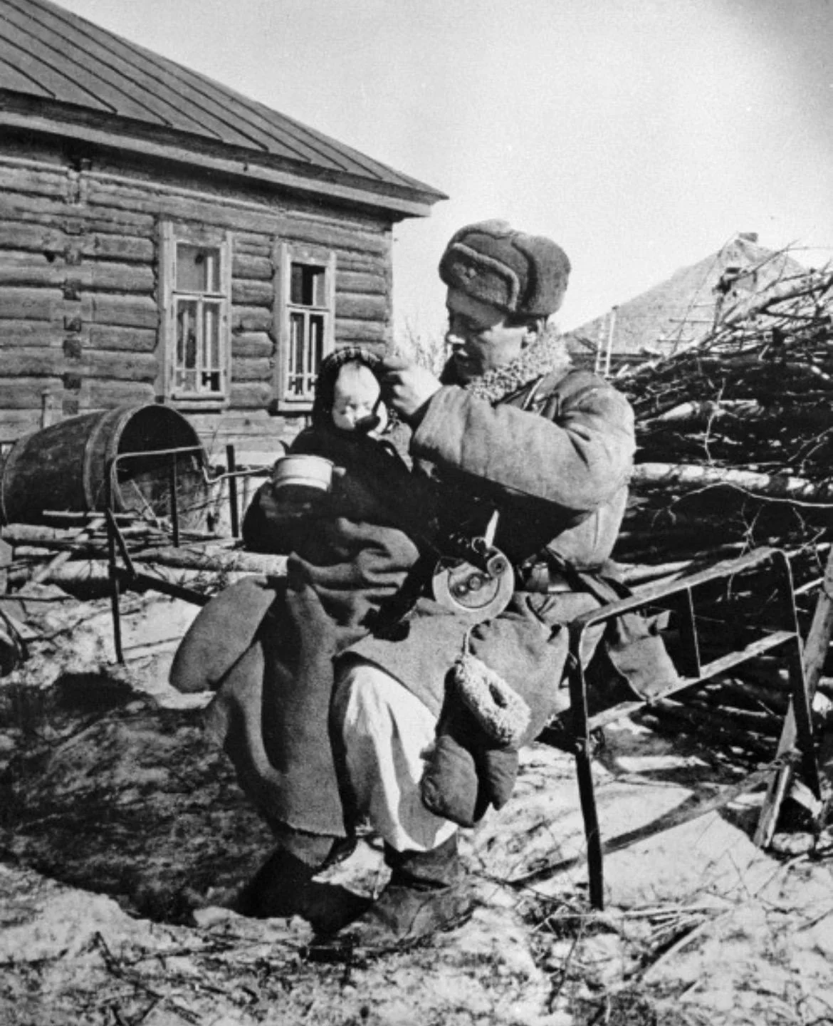 Red Army Soldier Feeding an Orphaned Baby, Russia 1943