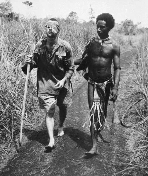 Raphael Oimbari Aids Wounded Australian Soldier, New Guinea 1942