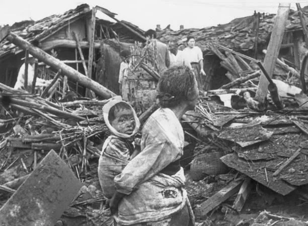 Korean War: Civilians Amidst Wreckage in Pyongyang, 1950