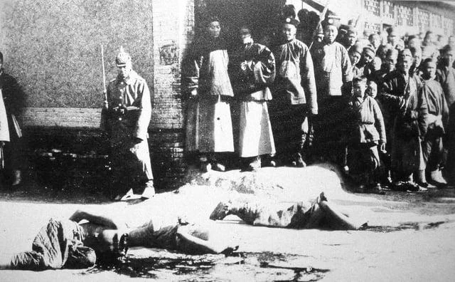 German Soldier and Executed Boxer Rebels in China, 1901